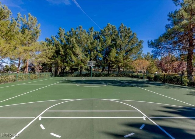 view of basketball court featuring community basketball court and fence