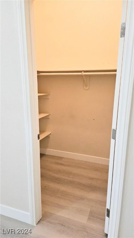 spacious closet with wood finished floors