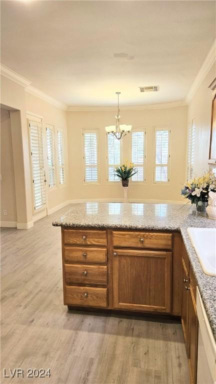 kitchen with dishwasher, visible vents, light wood-style flooring, and crown molding