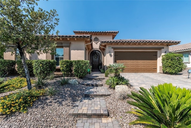 mediterranean / spanish house featuring a garage