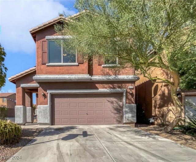 view of front of property featuring a garage