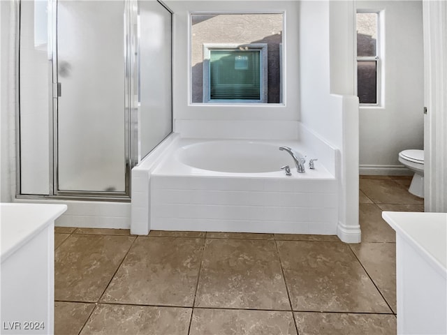 full bathroom featuring independent shower and bath, tile patterned flooring, vanity, and toilet