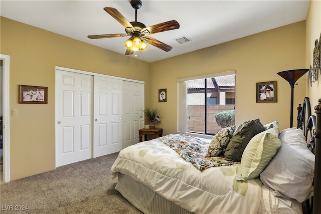 carpeted bedroom featuring ceiling fan and a closet