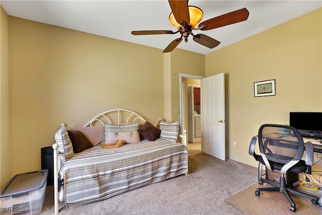 carpeted bedroom with washer / clothes dryer and ceiling fan