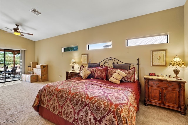 bedroom featuring light carpet, lofted ceiling, access to exterior, and ceiling fan