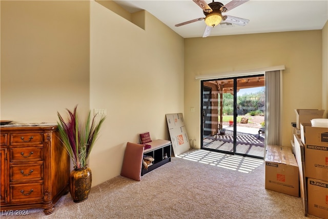 misc room featuring ceiling fan and light carpet