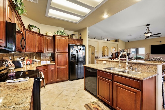 kitchen featuring sink, vaulted ceiling, black appliances, light tile patterned floors, and ceiling fan