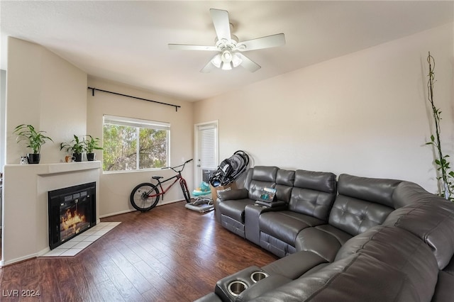 living room with hardwood / wood-style flooring and ceiling fan