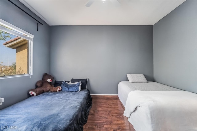 bedroom featuring ceiling fan and dark hardwood / wood-style floors