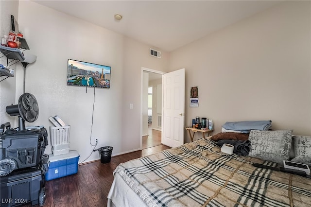 bedroom featuring dark hardwood / wood-style flooring