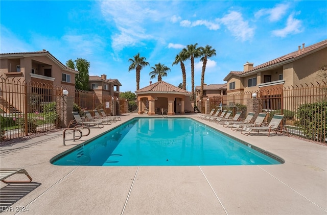 view of swimming pool with a patio area