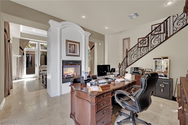 office area featuring a multi sided fireplace and ornamental molding