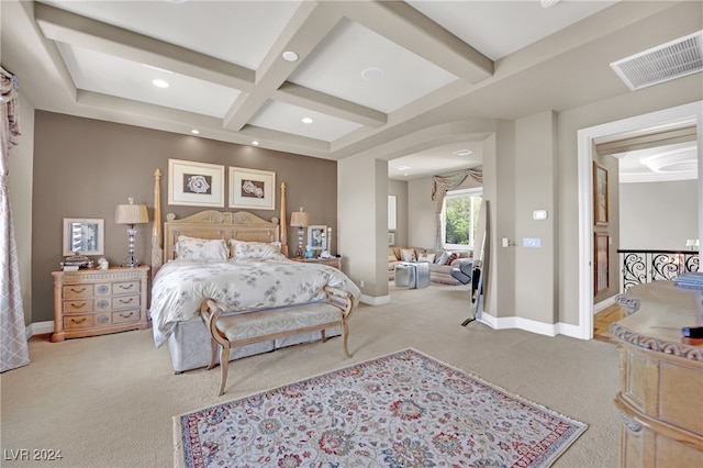 bedroom with coffered ceiling, beamed ceiling, and carpet