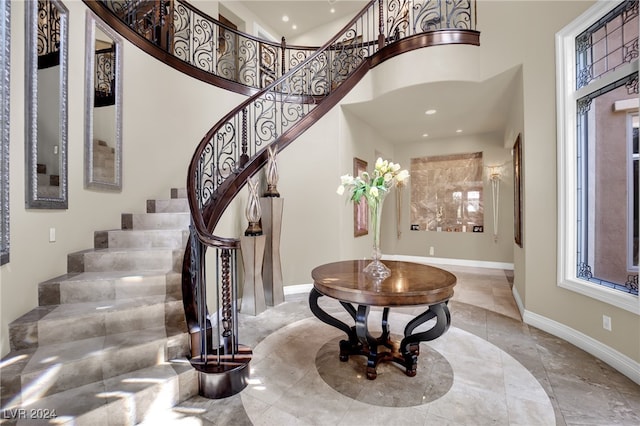 foyer entrance featuring a high ceiling