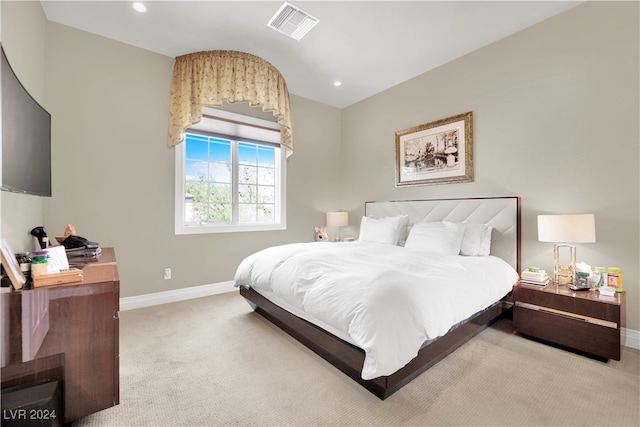 bedroom featuring light colored carpet