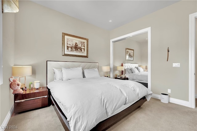 bedroom with light colored carpet