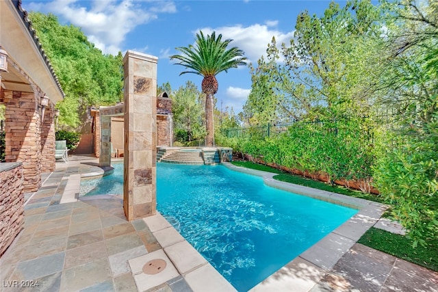 view of swimming pool featuring a patio area