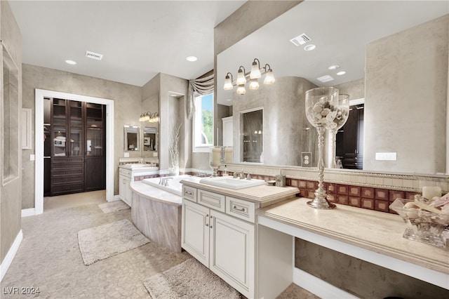 bathroom with vanity and a tub