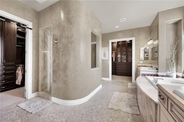 bathroom featuring vanity and plus walk in shower