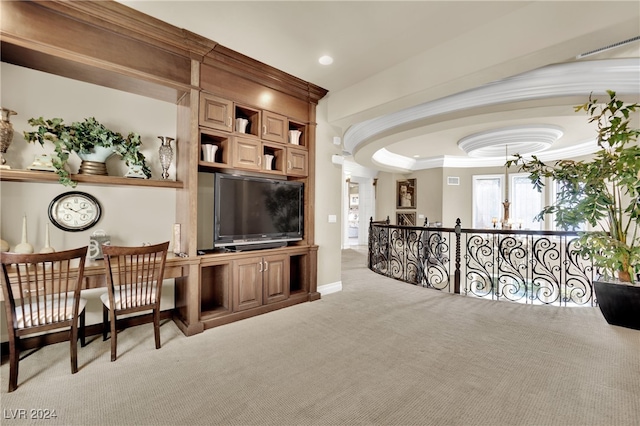 carpeted living room featuring an inviting chandelier, decorative columns, and crown molding