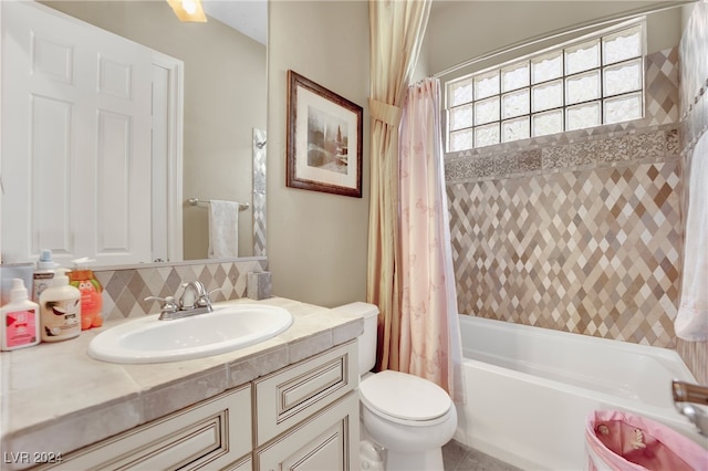 full bathroom featuring backsplash, vanity, toilet, and shower / bathtub combination with curtain