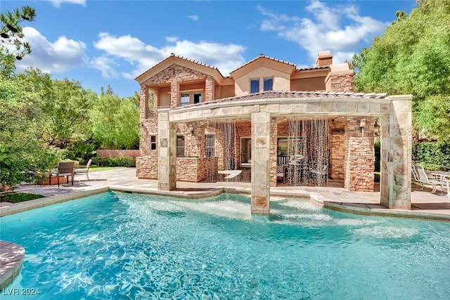 back of house with a patio