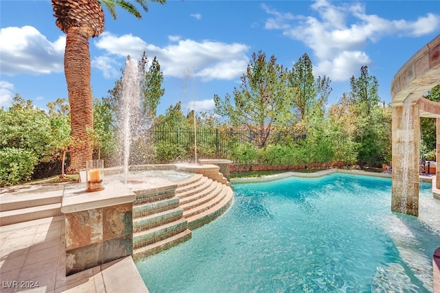 view of swimming pool featuring pool water feature