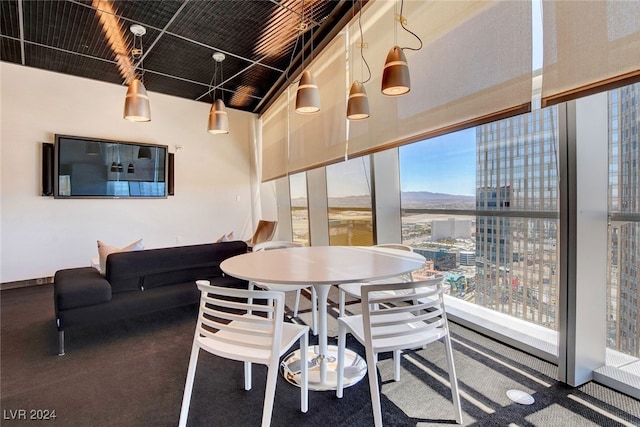 dining space with a wall of windows