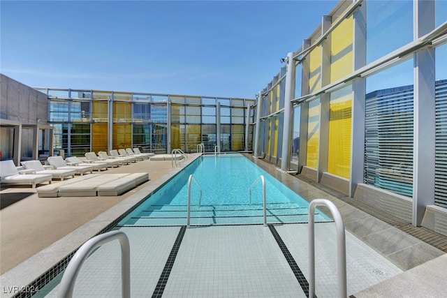 view of pool featuring a patio area