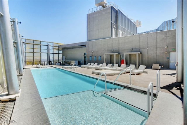 view of swimming pool with a patio