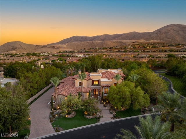 aerial view at dusk with a mountain view