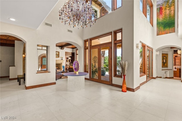 foyer entrance featuring a towering ceiling