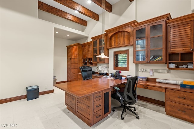 home office featuring built in desk and beam ceiling