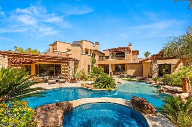 view of swimming pool featuring a patio, an in ground hot tub, and a pergola