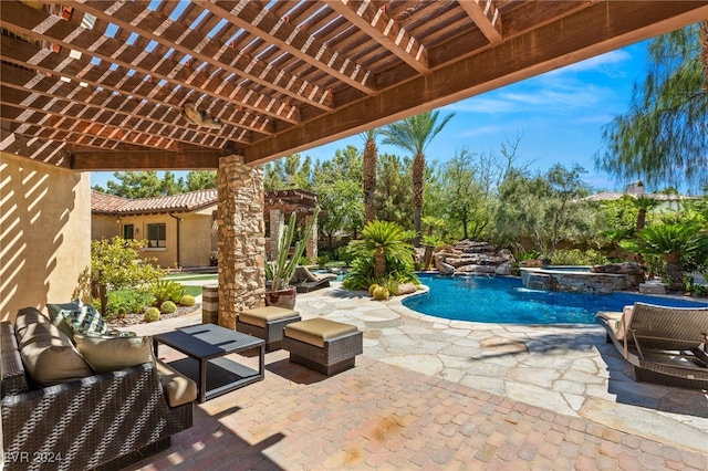 view of swimming pool with pool water feature, an outdoor hangout area, an in ground hot tub, a pergola, and a patio