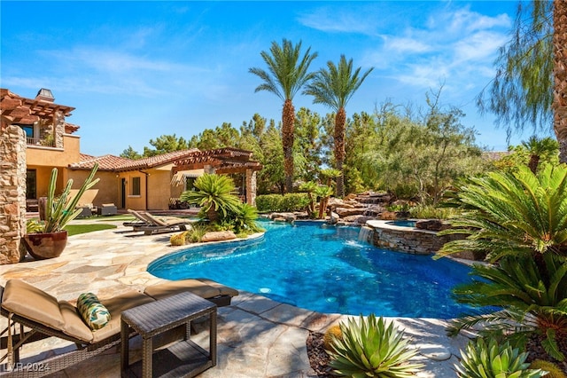 view of swimming pool featuring a patio and an in ground hot tub