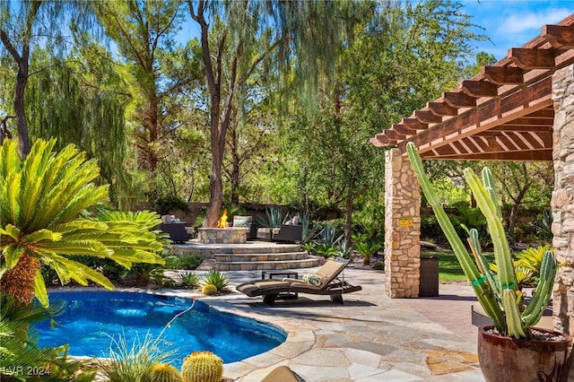 view of pool with a pergola and a patio area