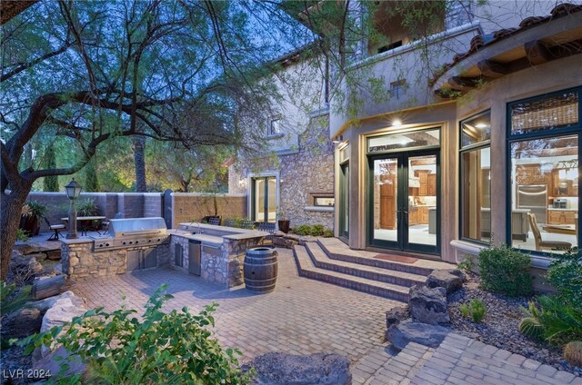 view of patio featuring exterior kitchen and french doors