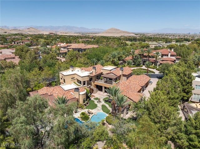 birds eye view of property featuring a mountain view