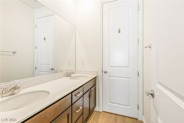 bathroom featuring vanity and wood-type flooring