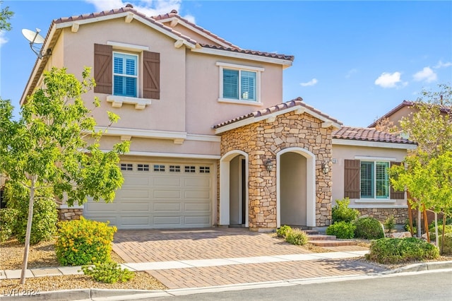 mediterranean / spanish-style house featuring a garage