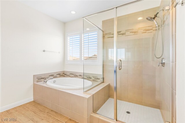 bathroom with independent shower and bath