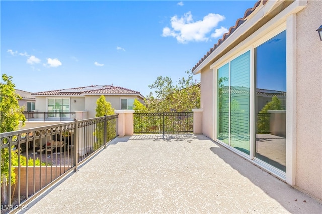 view of patio featuring a balcony