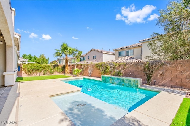 view of pool with a patio, a fenced backyard, and a residential view