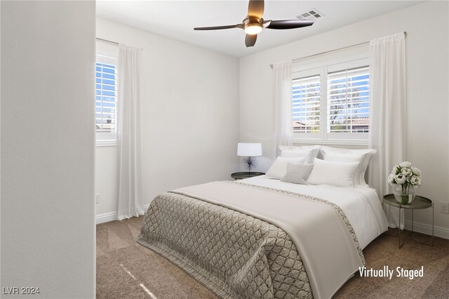 bedroom with ceiling fan and carpet