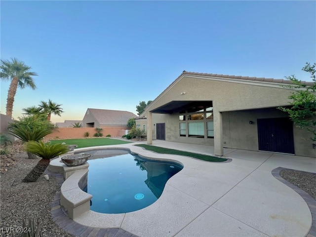 view of swimming pool with a fenced in pool, a patio area, and fence