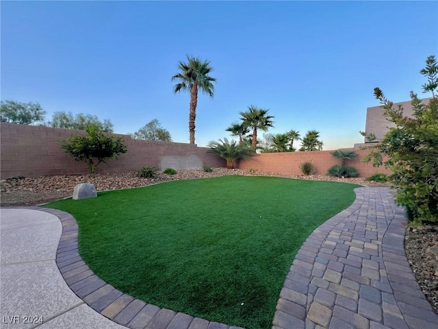 view of yard with a fenced backyard