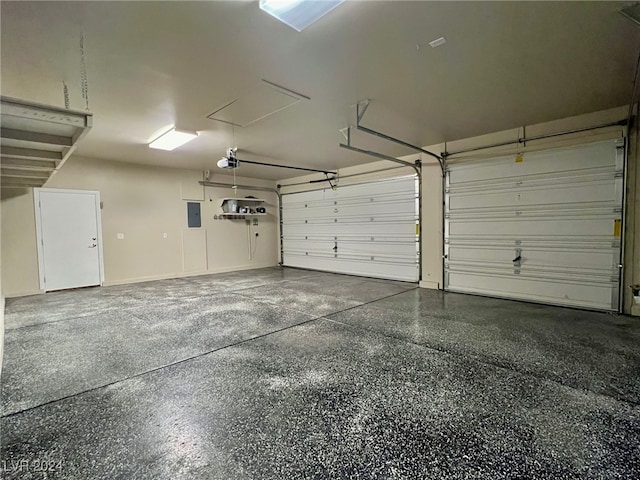 garage featuring a garage door opener and electric panel