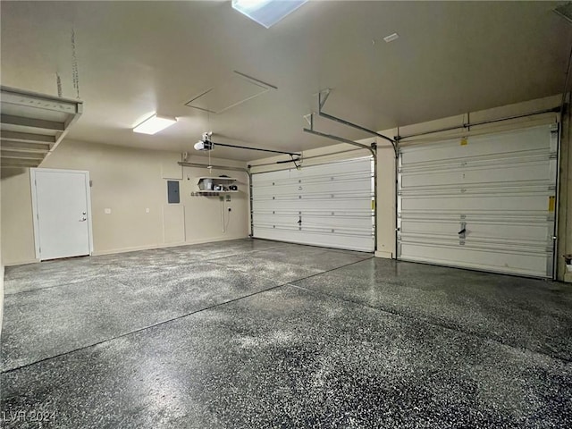 garage featuring electric panel and a garage door opener