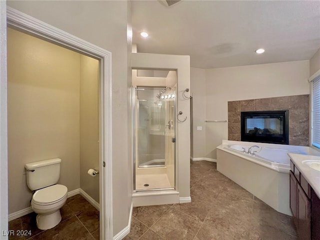 bathroom featuring toilet, a garden tub, a stall shower, and tile patterned flooring